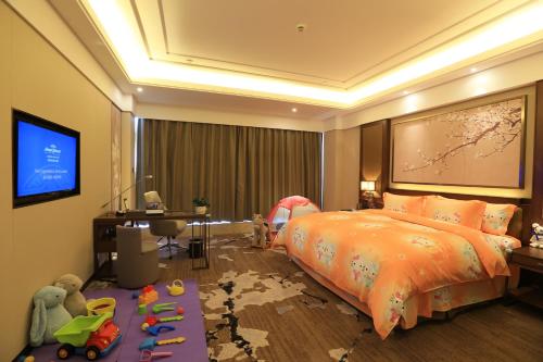 Imagen de la habitación del Hotel Howard Johnson Xiangyu Plaza Linyi. Foto 5