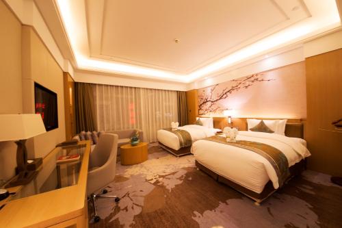 Imagen de la habitación del Hotel Howard Johnson Xiangyu Plaza Linyi. Foto 6