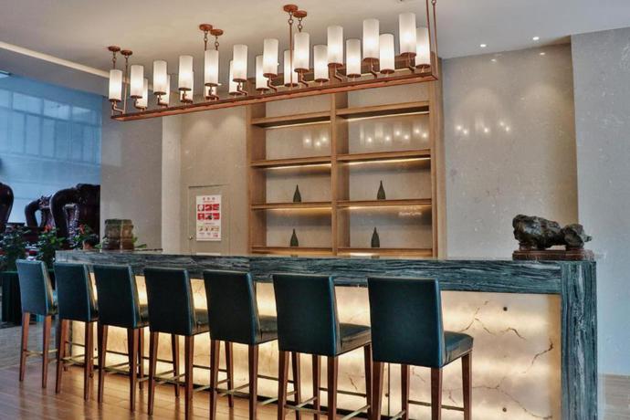 Imagen del bar/restaurante del Hotel Howard Johnson by Wyndham Caexpo Plaza Nanning. Foto 5