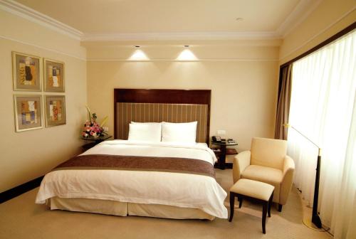 Imagen de la habitación del Hotel Howard Johnson by Wyndham Ginwa Plaza Hotel Xian. Foto 8