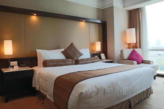 Imagen de la habitación del Hotel Howard Johnson by Wyndham Huaihai Hotel Shanghai. Foto 6