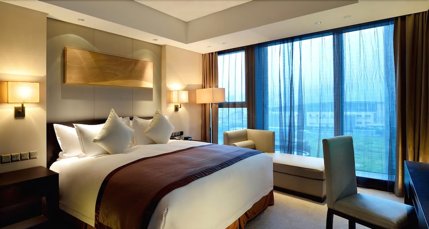 Imagen de la habitación del Hotel Howard Johnson by Wyndham IFC Plaza Ningbo. Foto 5