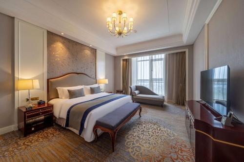 Imagen de la habitación del Hotel Howard Johnson by Wyndham Junhe Hot Springs Resort Beijing. Foto 14