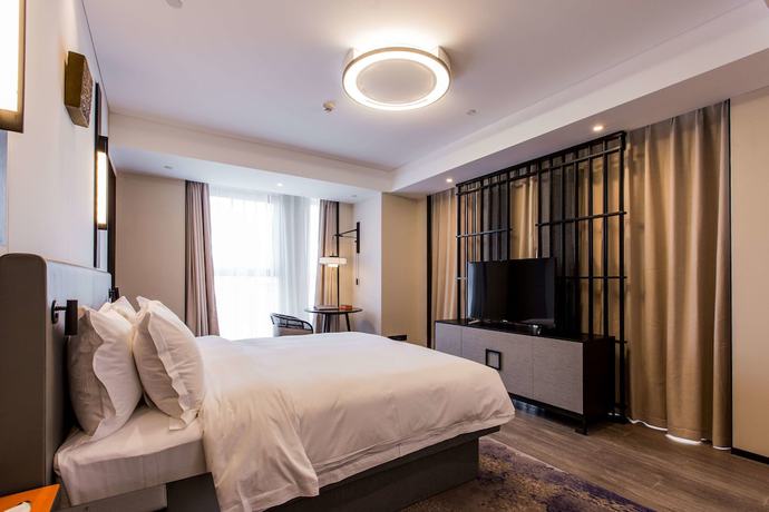 Imagen de la habitación del Hotel Howard Johnson by Wyndham Life ZhuoYuan Ningbo. Foto 11