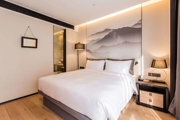 Imagen de la habitación del Hotel Howard Johnson by Wyndham Life ZhuoYuan Ningbo. Foto 19