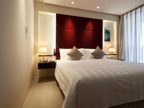 Imagen de la habitación del Hotel Howard Johnson by Wyndham Parkland Hotel Dalian. Foto 12