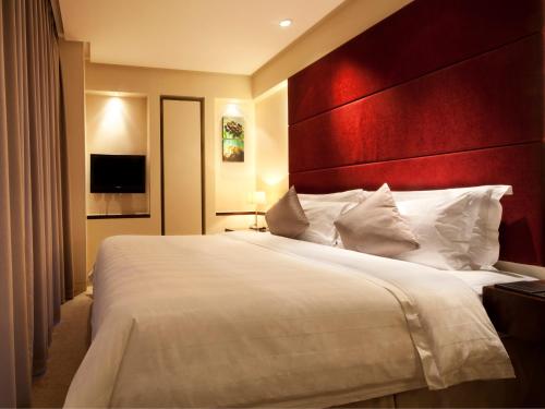 Imagen de la habitación del Hotel Howard Johnson by Wyndham Parkland Hotel Dalian. Foto 14
