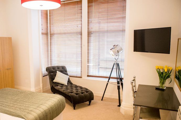 Imagen de la habitación del Hotel Howarth House Apartments. Foto 10