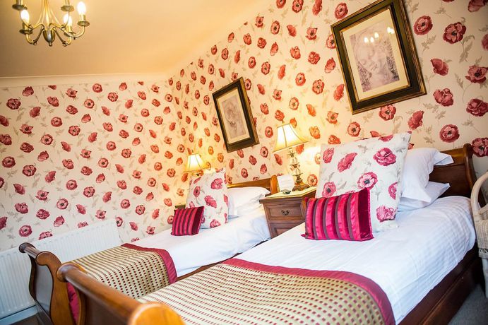 Imagen de la habitación del Hotel Howarth House. Foto 11