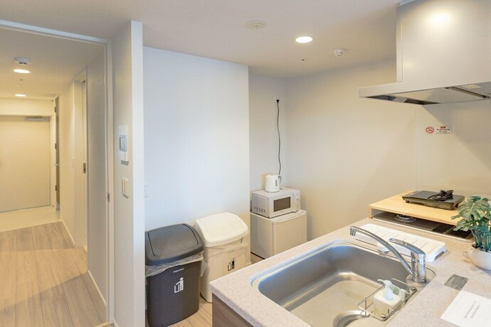 Imagen de la habitación del Hotel Hoyou Suite Residence Osaka Ashiharabashi Station Front. Foto 18