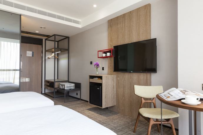 Imagen de la habitación del Hotel Hsin. Foto 7