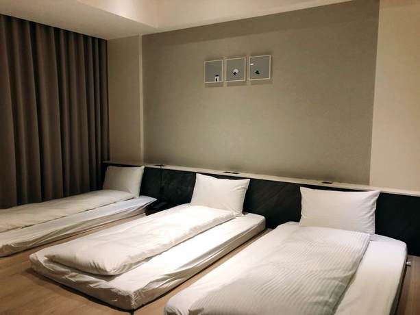 Imagen de la habitación del Hotel Hsin. Foto 17