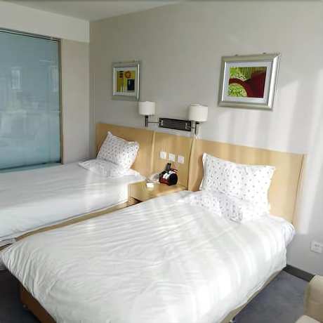 Imagen de la habitación del Hotel Hua Cheng Hotel. Foto 3