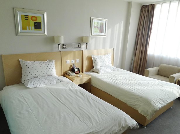 Imagen de la habitación del Hotel Hua Cheng Hotel. Foto 7