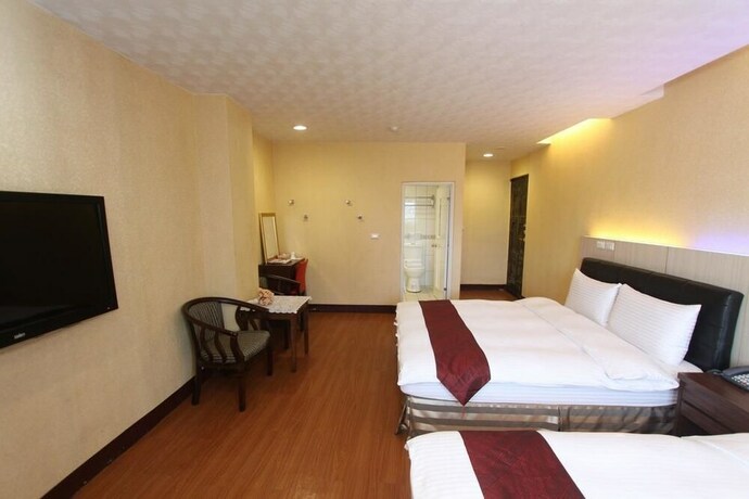 Imagen de la habitación del Hotel Hua Don. Foto 22