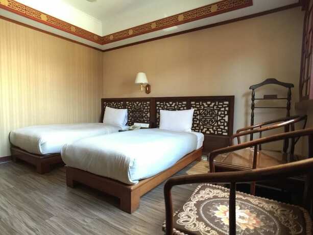 Imagen de la habitación del Hotel Hua Du, Yizhong. Foto 23