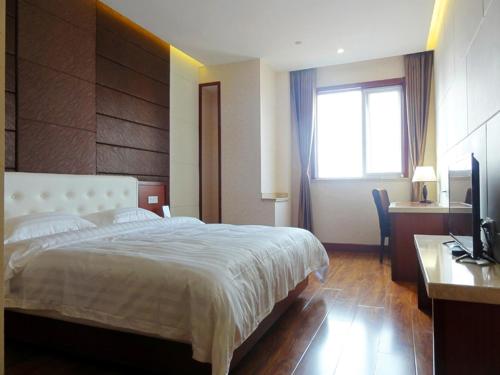 Imagen de la habitación del Hotel Hua Qi Kaiserdom Zhongshan Road St Michael's Cathedral and Zhanqiao Pier Qingdao. Foto 6