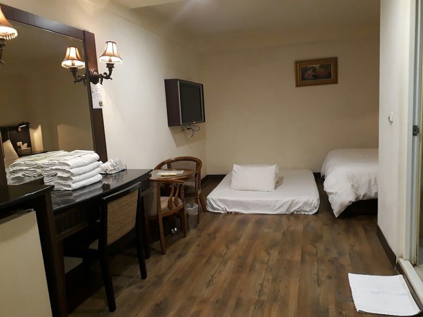 Imagen de la habitación del Hotel Hua Tai. Foto 19