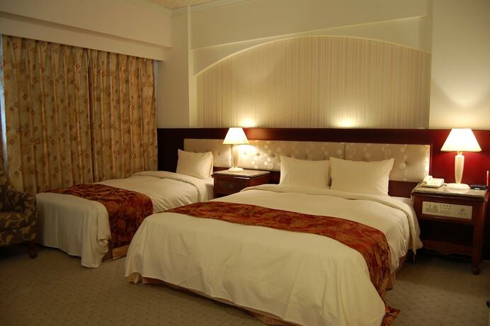 Imagen de la habitación del Hotel Hua Tong. Foto 13