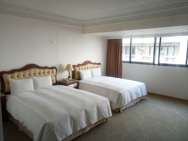 Imagen de la habitación del Hotel Hua Tong. Foto 15