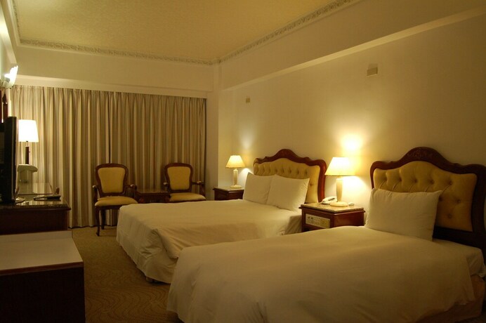 Imagen de la habitación del Hotel Hua Tong. Foto 16