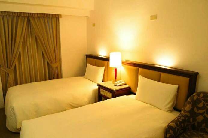 Imagen de la habitación del Hotel Hua Tong. Foto 22