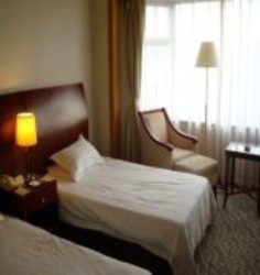Imagen de la habitación del Hotel Hua Xia Hotel. Foto 3