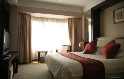 Imagen de la habitación del Hotel Hua Xia Hotel. Foto 4