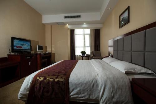 Imagen de la habitación del Hotel Hua Xin International. Foto 7