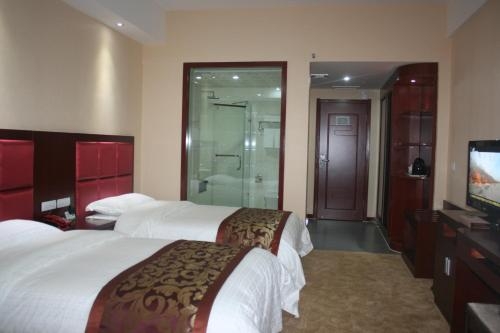 Imagen de la habitación del Hotel Hua Xin International. Foto 9