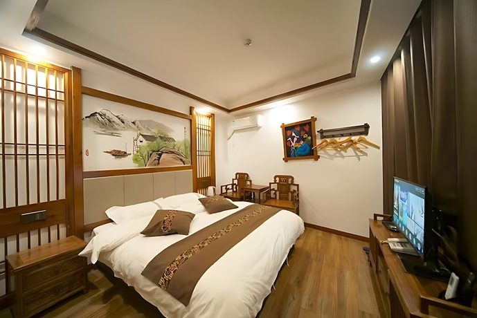 Imagen de la habitación del Hotel HuaHarmony Wulingyuan City Inn. Foto 2