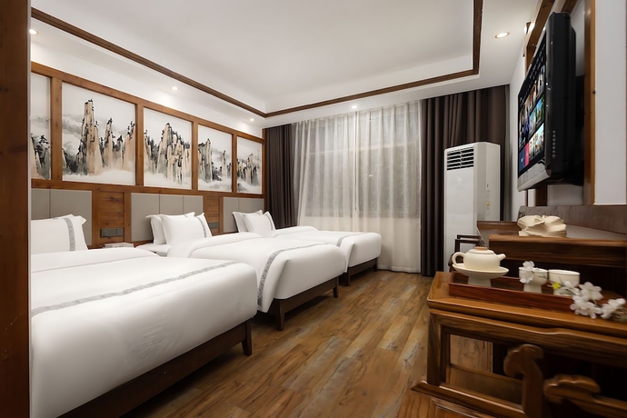 Imagen de la habitación del Hotel HuaHarmony Wulingyuan City Inn. Foto 3
