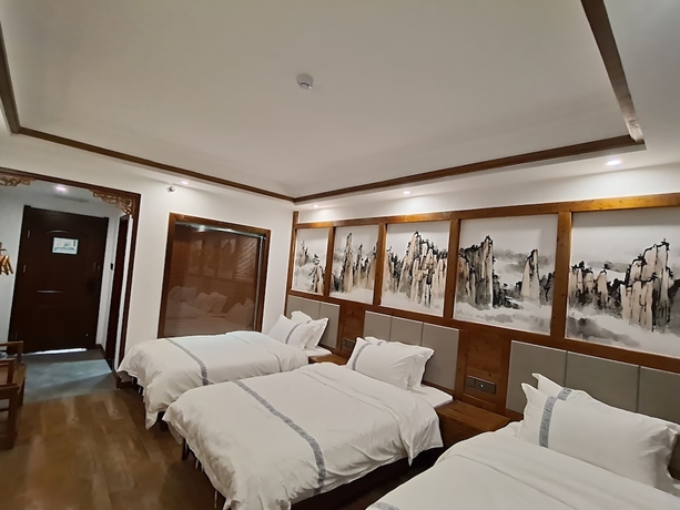 Imagen de la habitación del Hotel HuaHarmony Wulingyuan City Inn. Foto 4