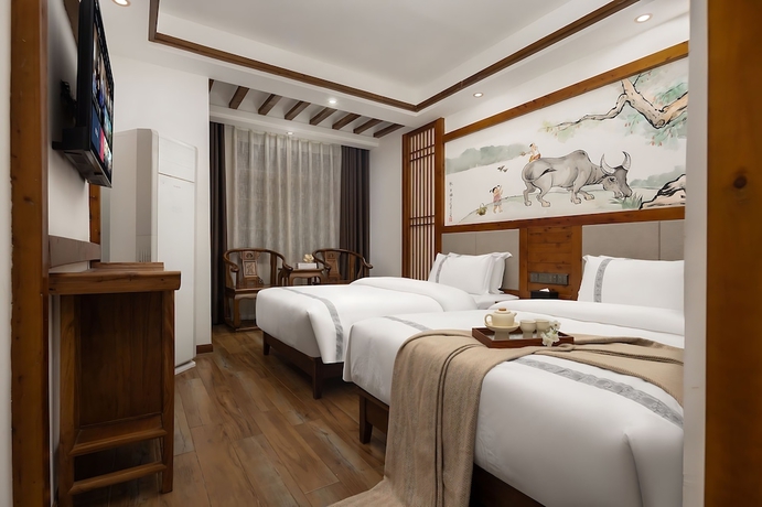 Imagen de la habitación del Hotel HuaHarmony Wulingyuan City Inn. Foto 5