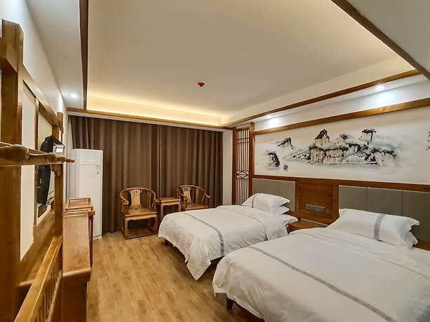Imagen de la habitación del Hotel HuaHarmony Wulingyuan City Inn. Foto 6