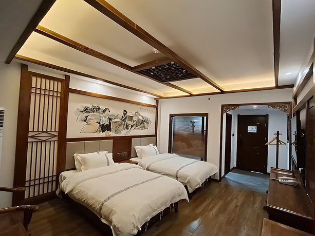 Imagen de la habitación del Hotel HuaHarmony Wulingyuan City Inn. Foto 7