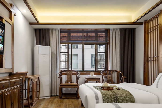 Imagen de la habitación del Hotel HuaHarmony Wulingyuan City Inn. Foto 8