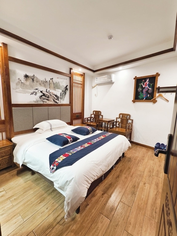 Imagen de la habitación del Hotel HuaHarmony Wulingyuan City Inn. Foto 9