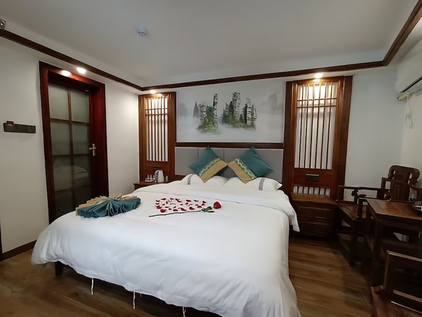 Imagen de la habitación del Hotel HuaHarmony Wulingyuan City Inn. Foto 10