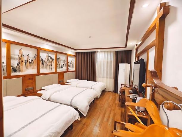 Imagen de la habitación del Hotel HuaHarmony Wulingyuan City Inn. Foto 11