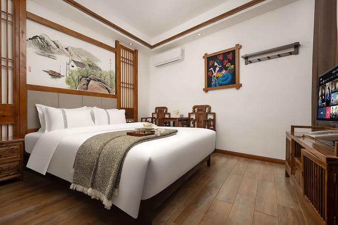 Imagen de la habitación del Hotel HuaHarmony Wulingyuan City Inn. Foto 12