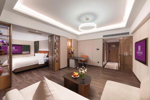 Imagen de la habitación del Hotel HuaXi International. Foto 20