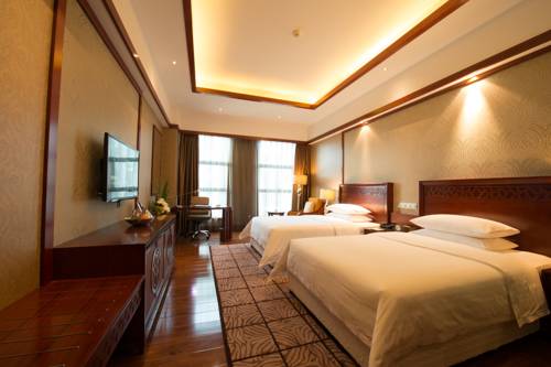 Imagen de la habitación del Hotel Huachen International. Foto 5