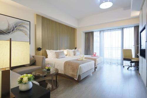 Imagen de la habitación del Hotel Huafa Place. Foto 5