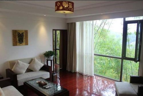 Imagen de la habitación del Hotel Huangguoshu. Foto 7