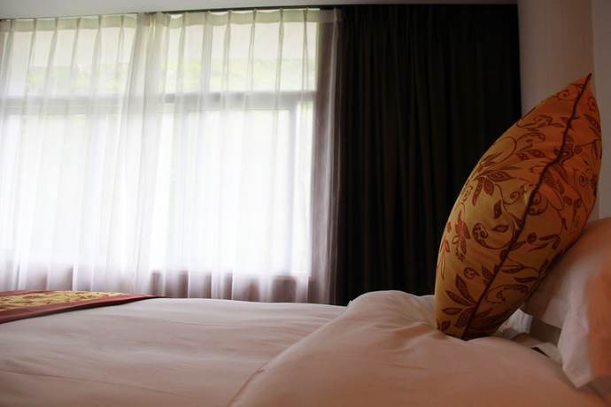 Imagen de la habitación del Hotel Huangguoshuyuquanhotel. Foto 3