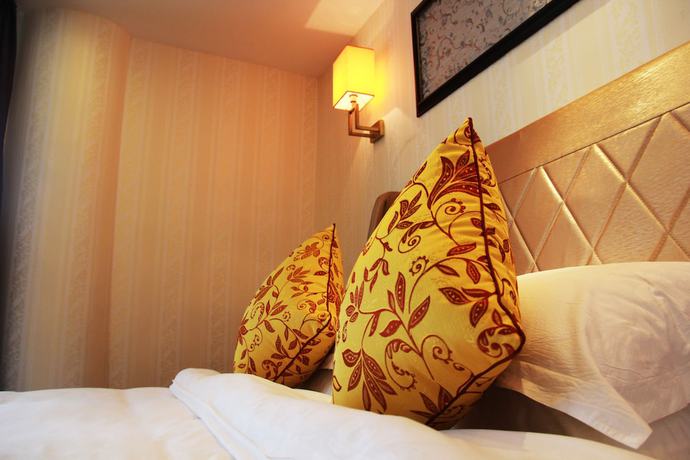 Imagen de la habitación del Hotel Huangguoshuyuquanhotel. Foto 6