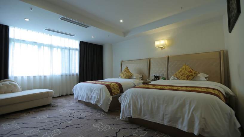 Imagen de la habitación del Hotel Huangguoshuyuquanhotel. Foto 8