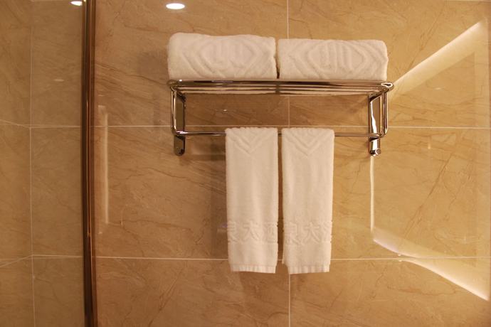 Imagen de la habitación del Hotel Huangguoshuyuquanhotel. Foto 16