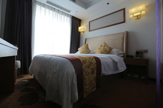 Imagen de la habitación del Hotel Huangguoshuyuquanhotel. Foto 17